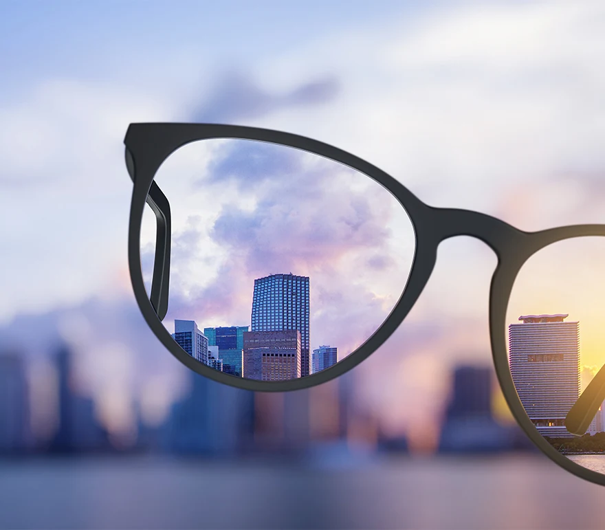 view of blurry city coming into focus with glasses