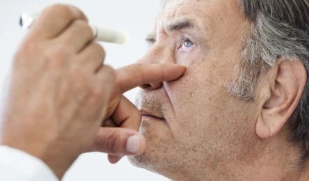 senior man eye exam for diabetic retinopathy