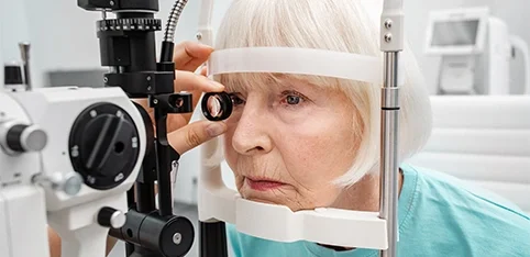 Elderly woman at the opthalmologist having an eye exam