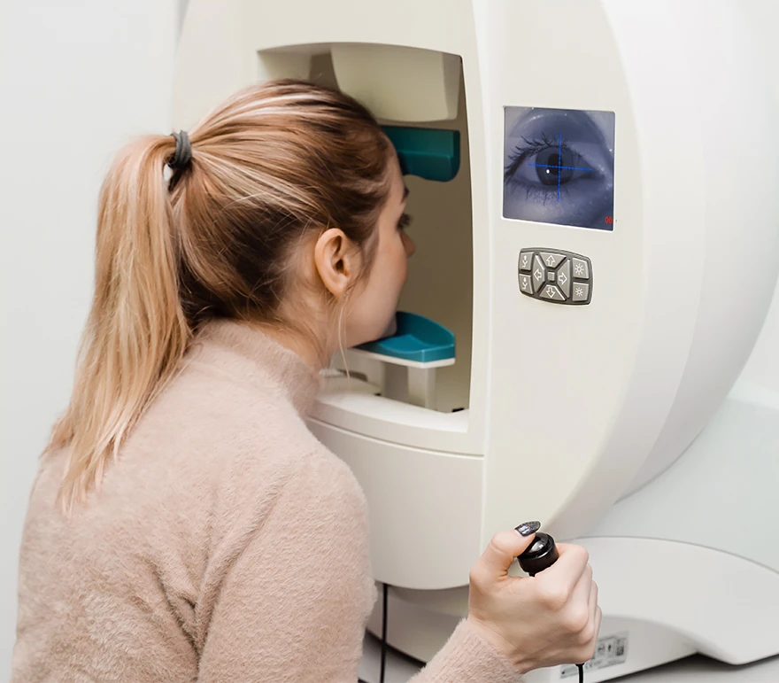 woman taking humphrey visual field test