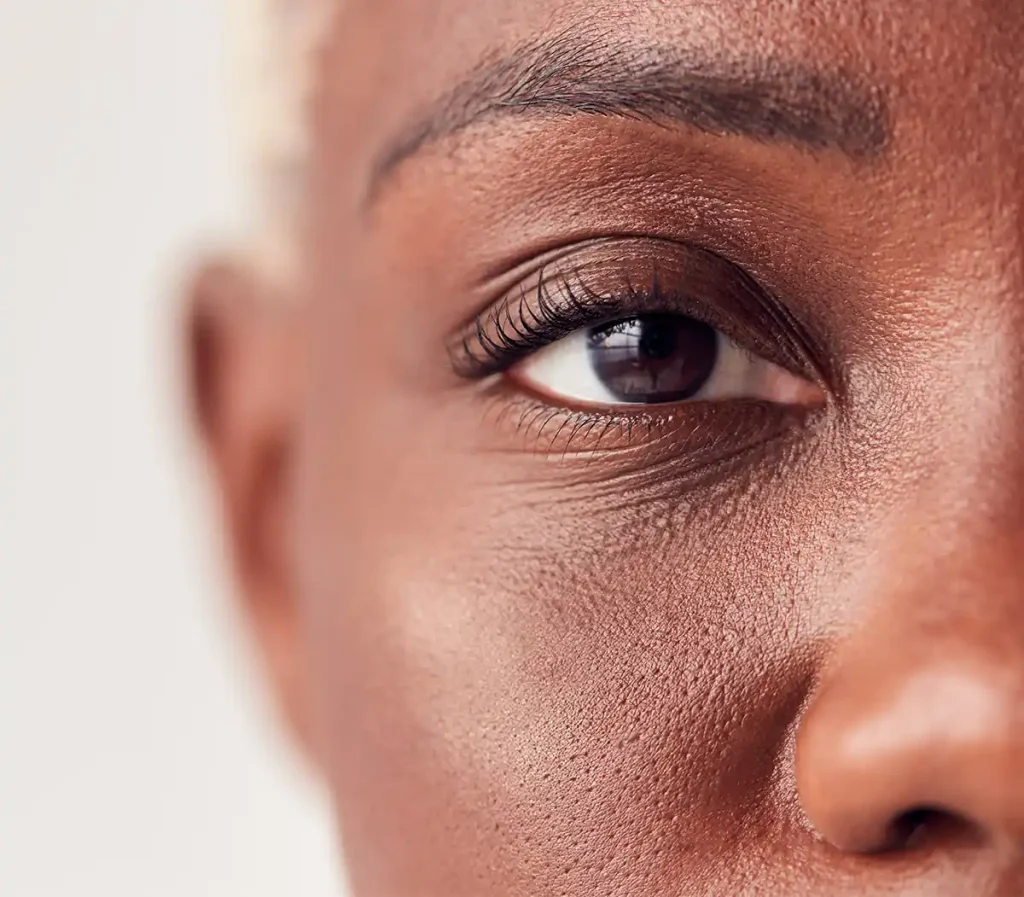 brown eye of middle-aged-woman close-up