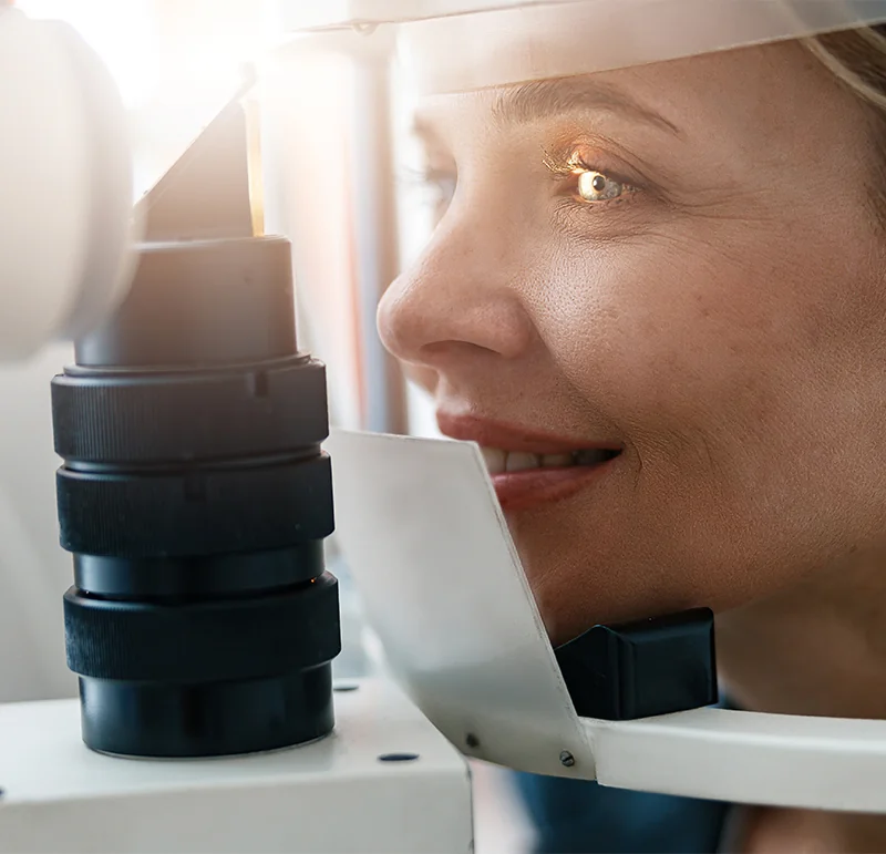 Woman having retina examined