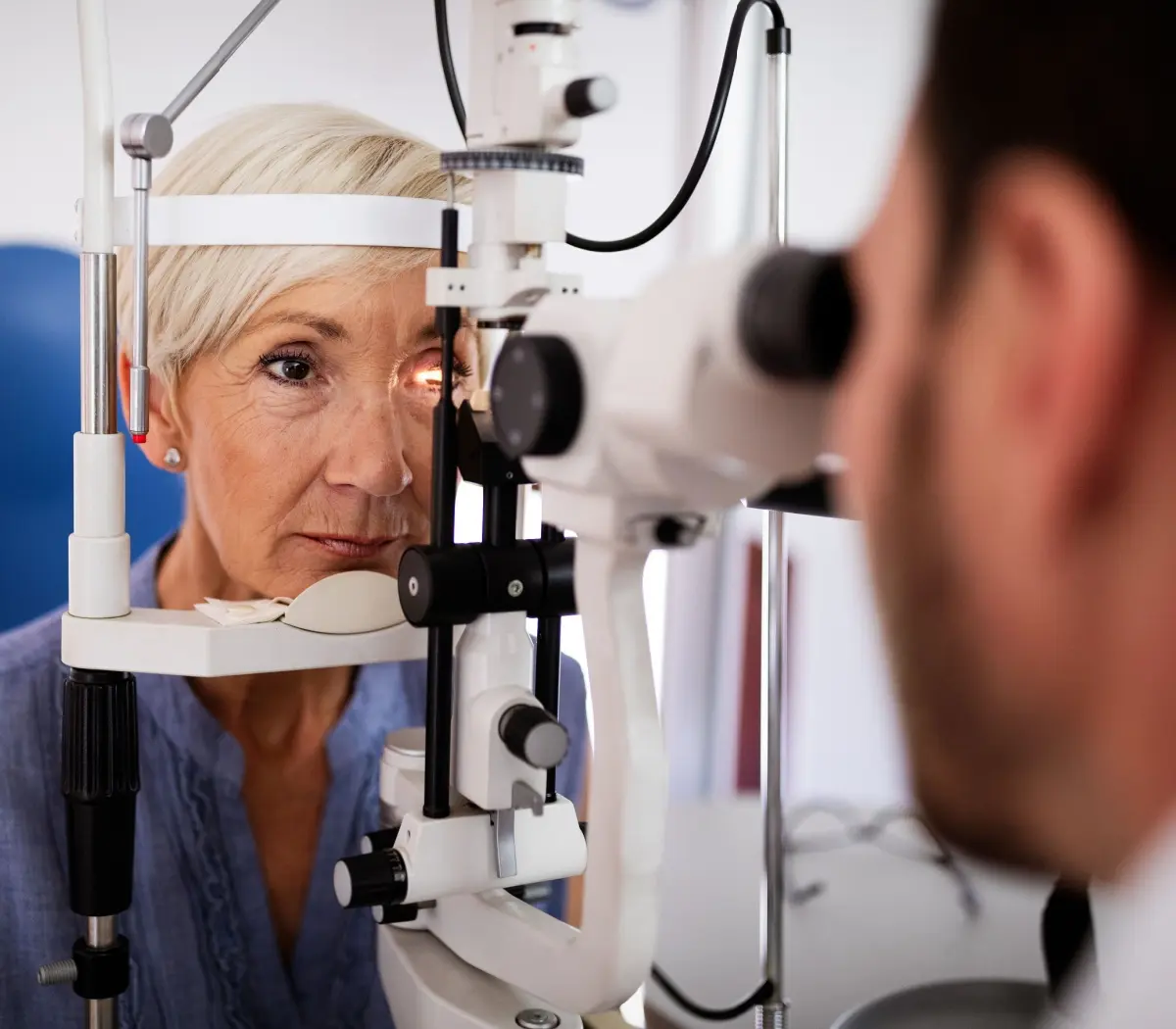 Patient eye vision examination in ophthalmological clinic
