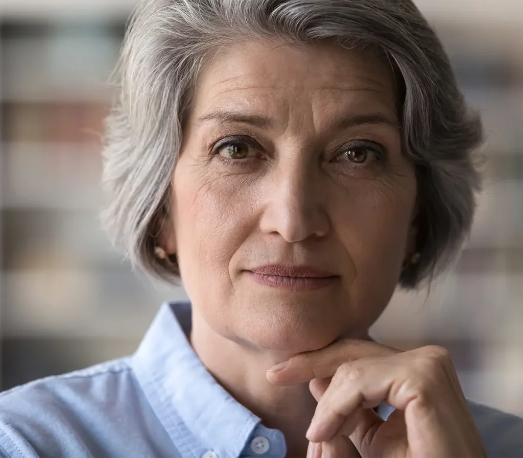Serious mature woman looking into camera