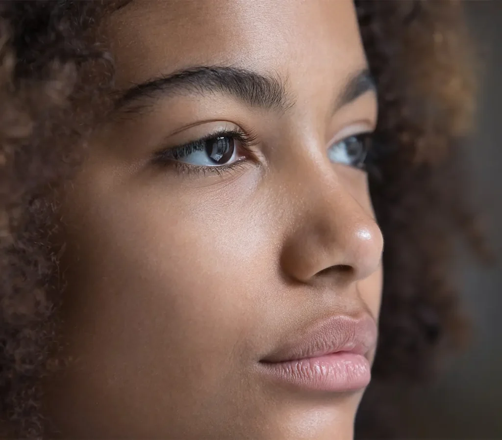 Serious young woman looking off to the side