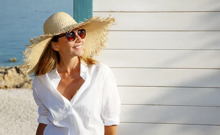 woman wearing hat and sunglasses