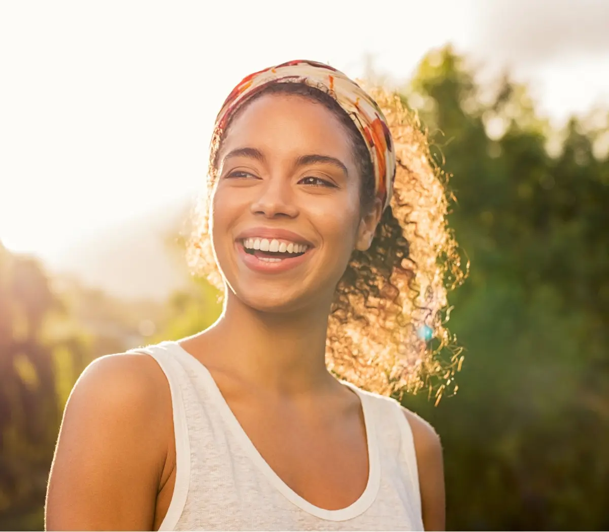 Happy cheerful girl laughing at park