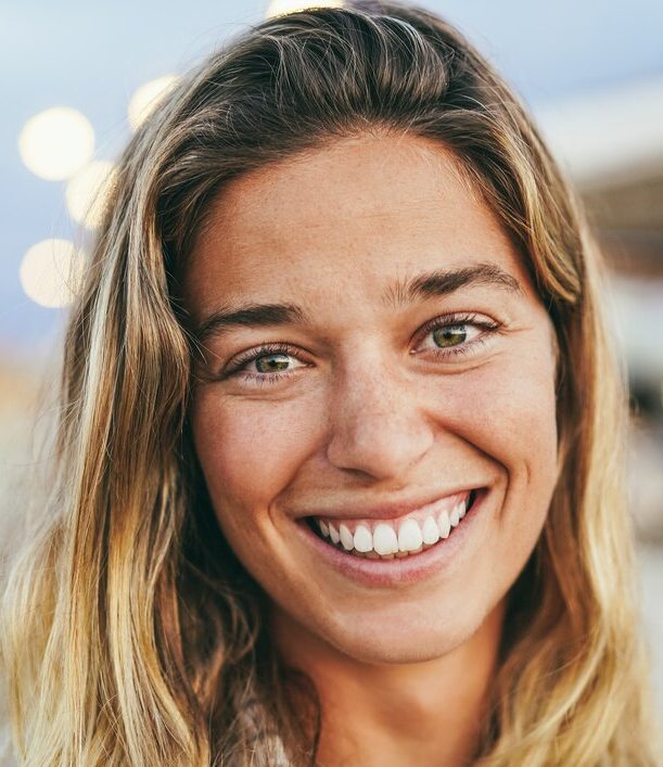 woman smiling and looking into the camera